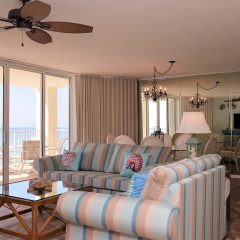 Open concept living room dining room combination with balcony access