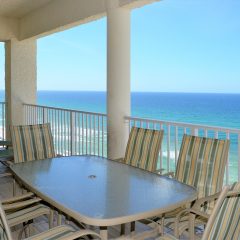 Super sized balcony with table and two chaise lounge chairs