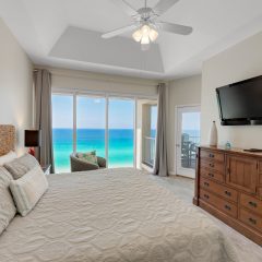 Large flat screen tv in master with balcony access