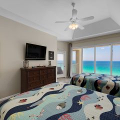 Guest room with flat screen tv and balcony access