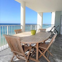 Balcony with seating for 4 and two chaise lounge chairs