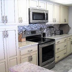 New cabinetry, granite, appliances, tile flooring and backsplash