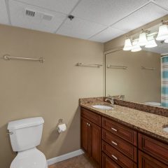 Guest room has dual sinks and garden tub shower combination