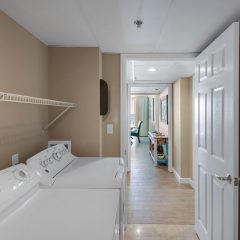 Full sized washer and dryer in laundry room