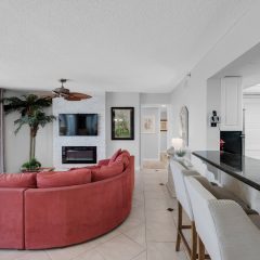 New flat screen tv and electric fireplace with stacked stone enclosure