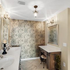 Master bath wtih dual sinks and vanity area