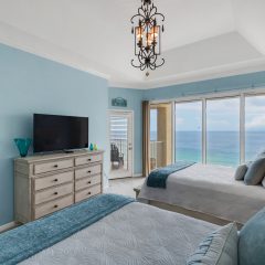 Guest room with flat screen tv and balcony access