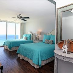 Guest room with two queen beds and full-on Gulf view